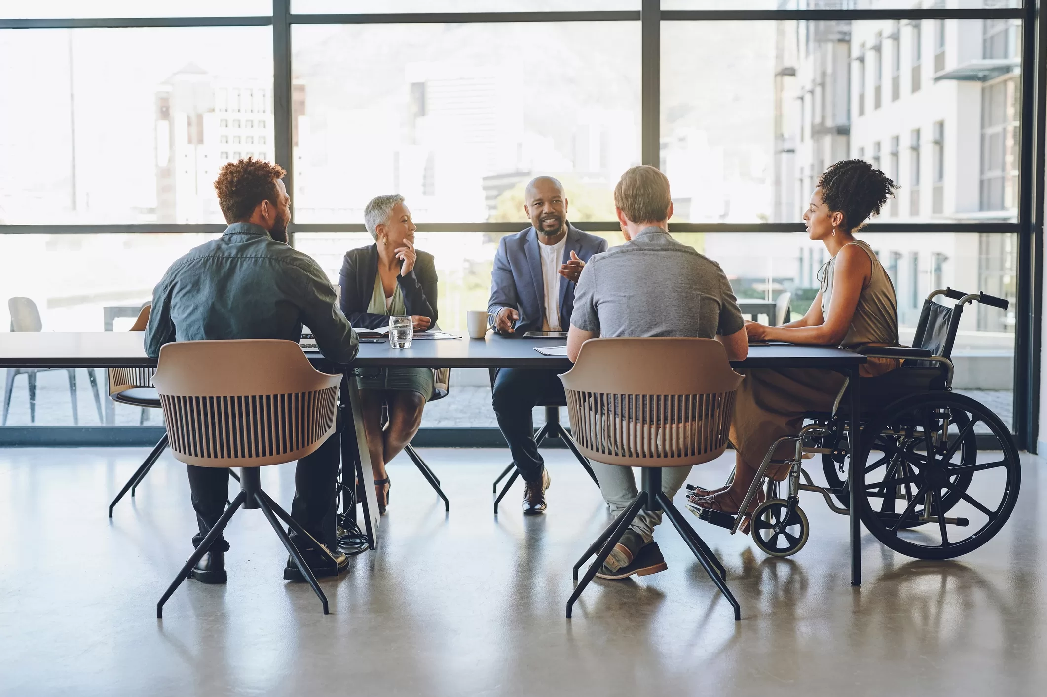 People sat around the table in the office