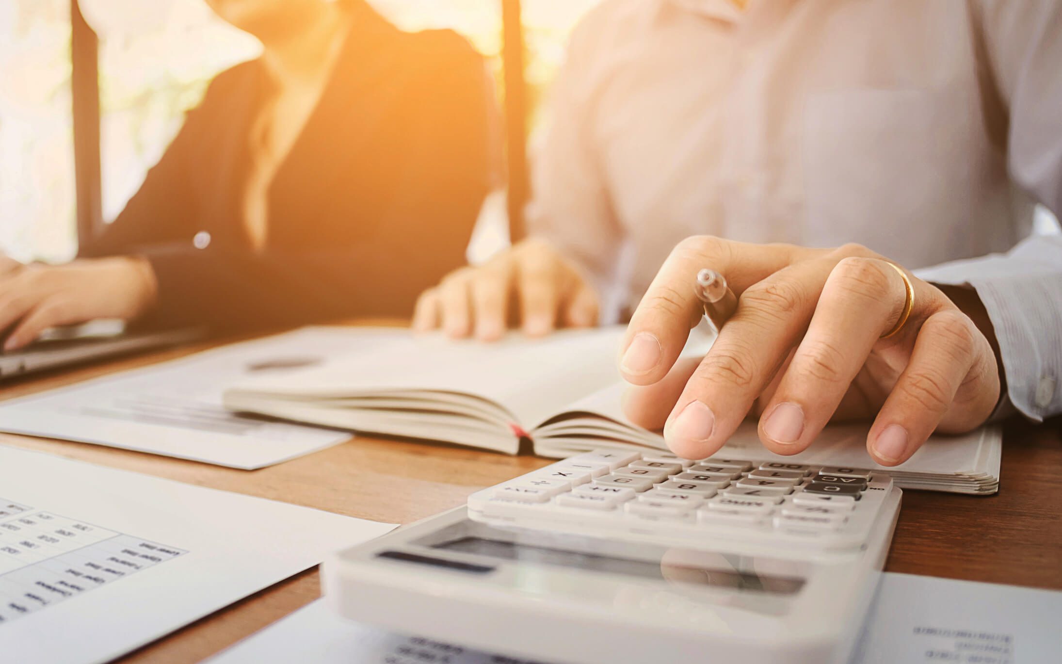 Employees calculating loss of profit
