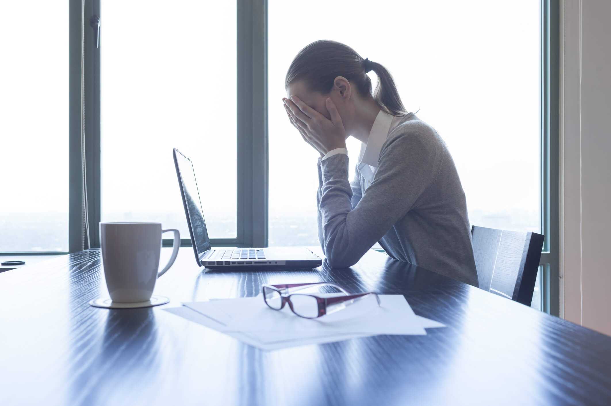 Upset woman dealing with work grievance