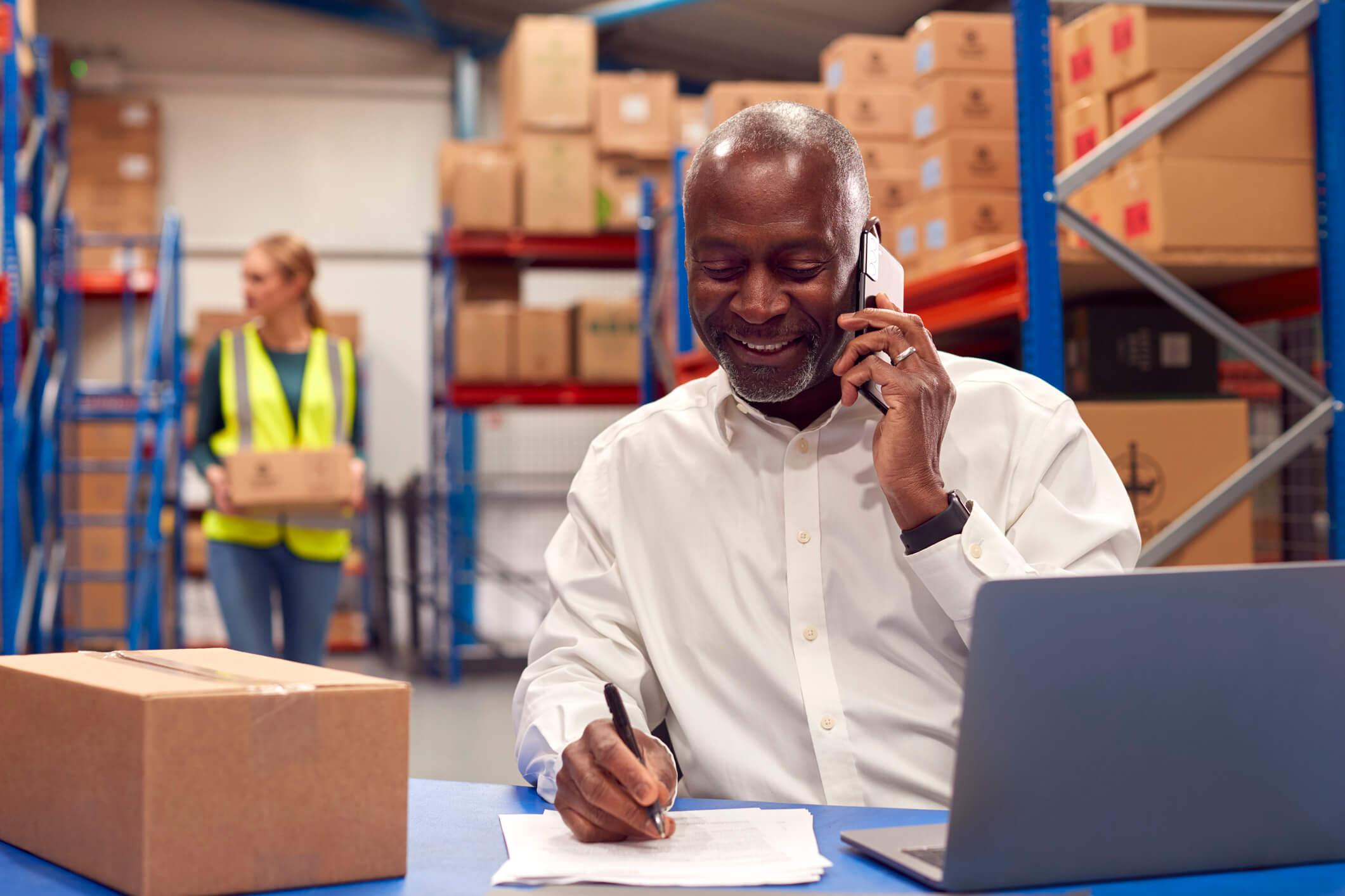 Warehouse manager working to distribute goods