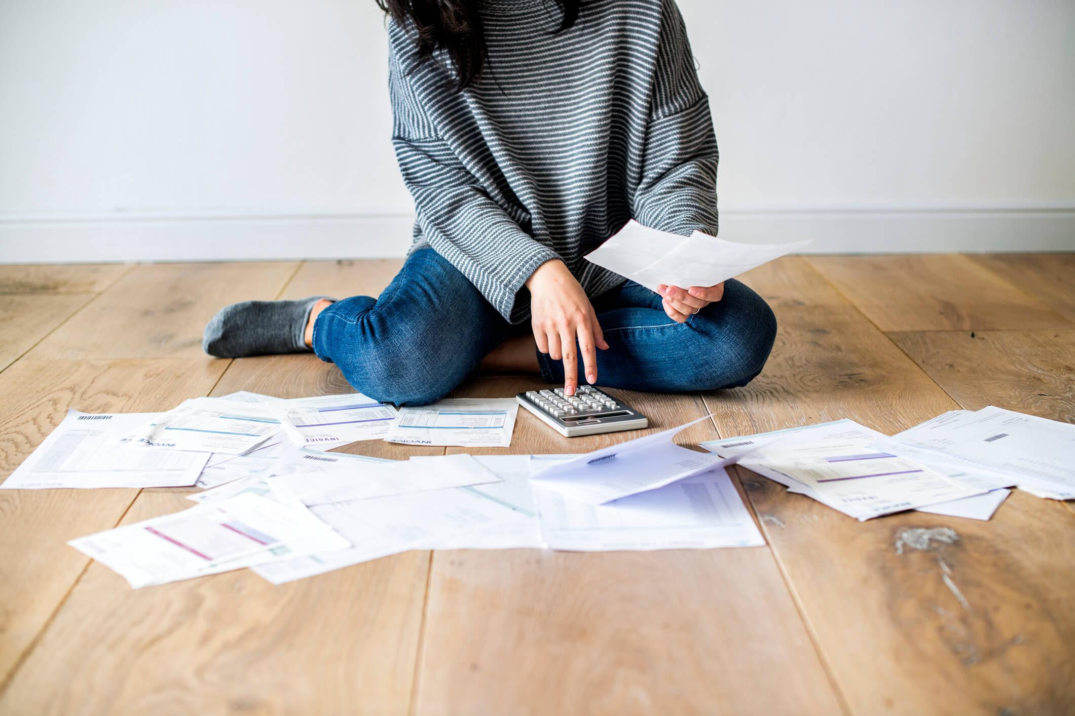 Woman calculating debts